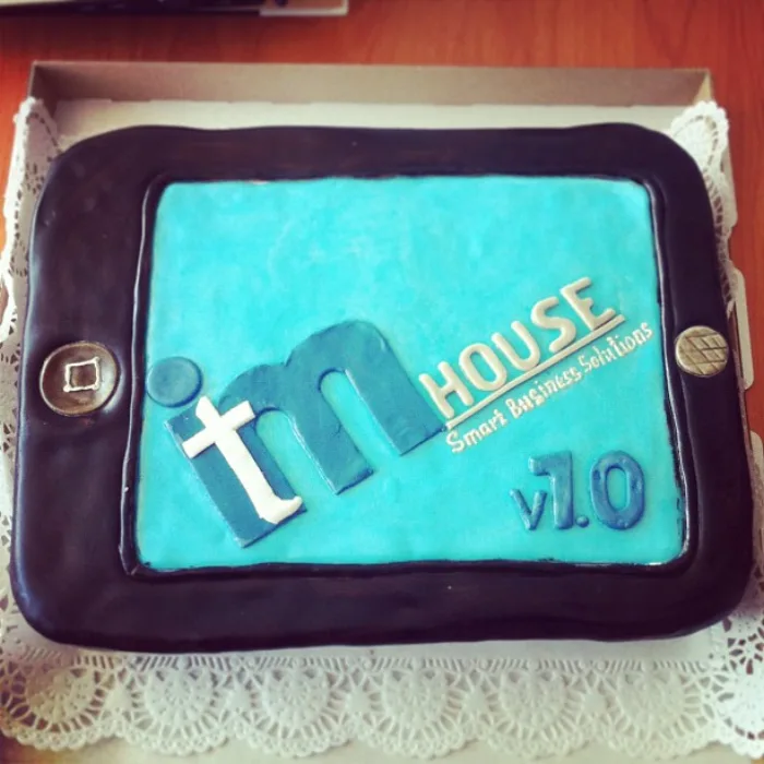 ITM House anniversary cake shaped like a tablet