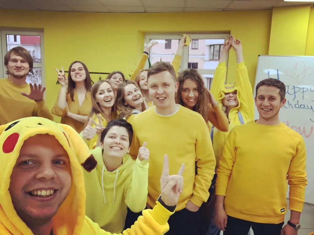 Yellow team members wearing yellow at the office